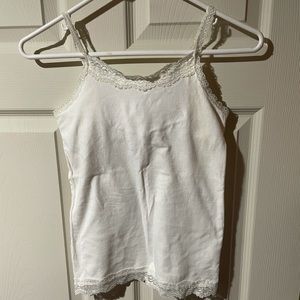 Girls white laces trimmed tank top with shelf bra.
